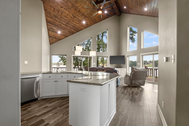 kitchen with high vaulted ceiling, dishwasher, wood ceiling, and dark stone counters