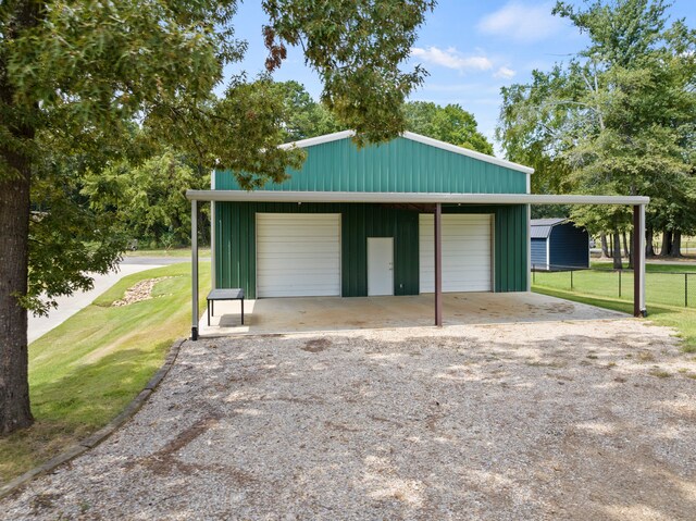 garage featuring a lawn