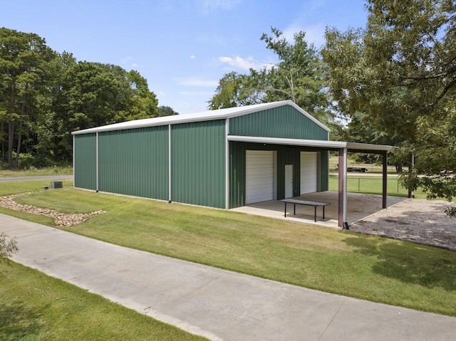 view of pole building with a yard