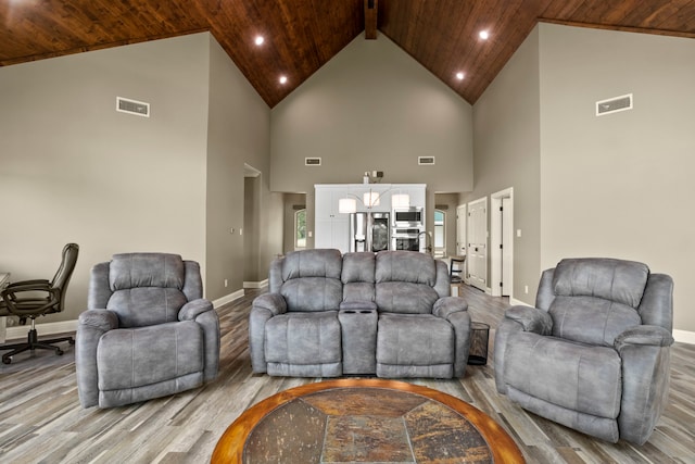 living room featuring wood ceiling, light hardwood / wood-style flooring, and high vaulted ceiling