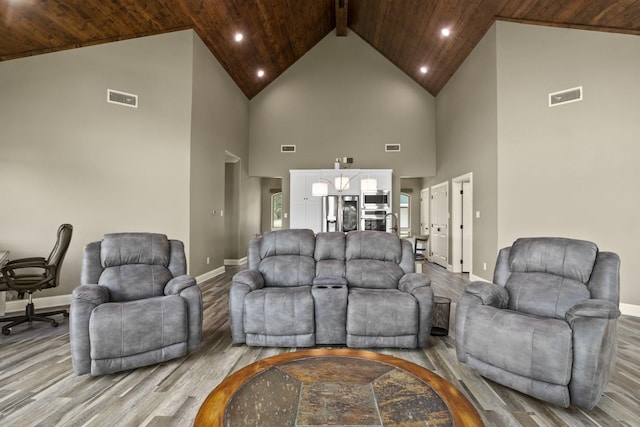 living area with light wood-style floors, wood ceiling, visible vents, and baseboards