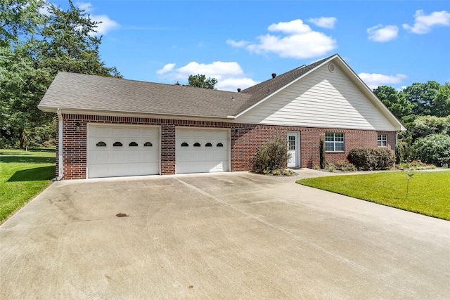 ranch-style house with an attached garage, driveway, a front yard, and brick siding