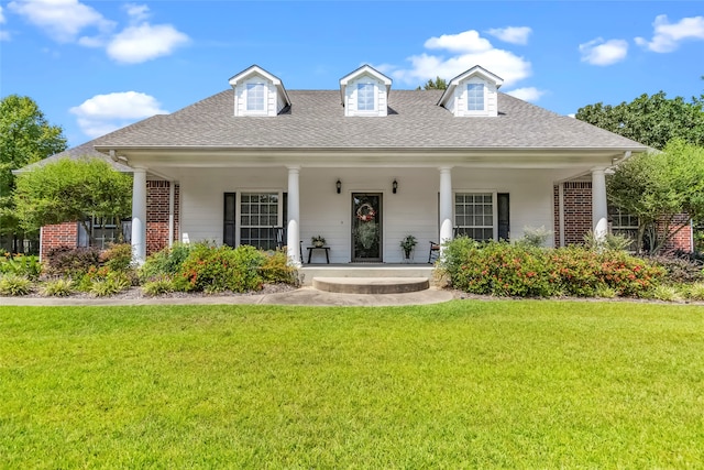 back of property featuring a yard