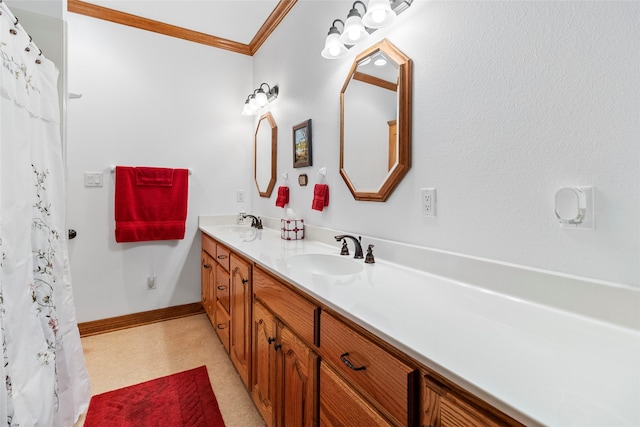 bathroom featuring ornamental molding and vanity