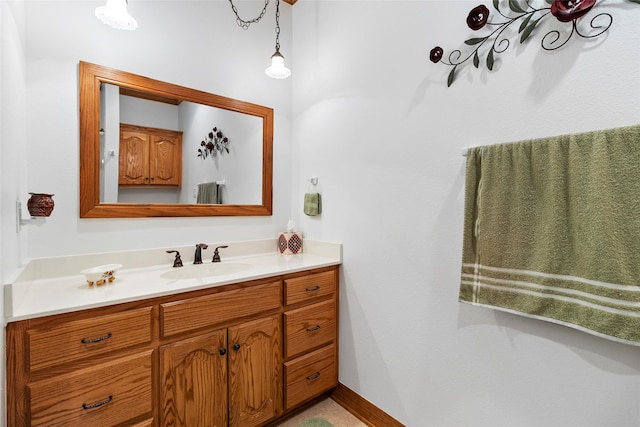 bathroom featuring vanity and baseboards