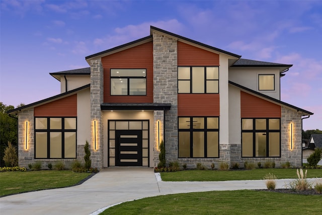 contemporary home featuring a lawn