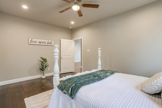 bedroom with dark hardwood / wood-style flooring and ceiling fan