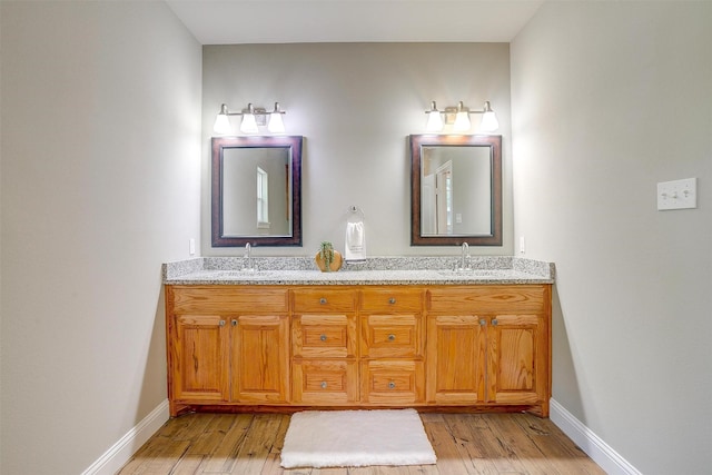 bathroom featuring vanity and hardwood / wood-style floors