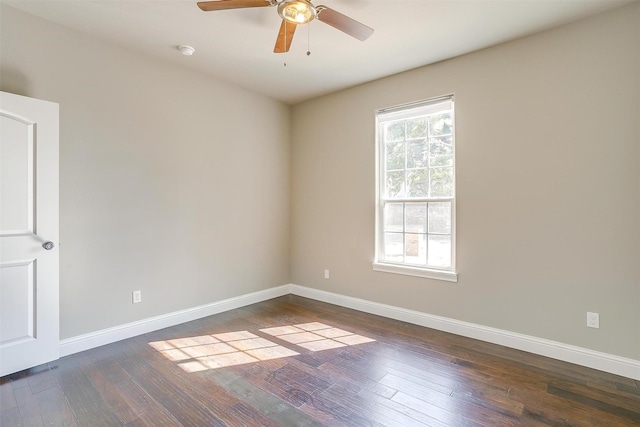 unfurnished room featuring dark hardwood / wood-style floors and ceiling fan