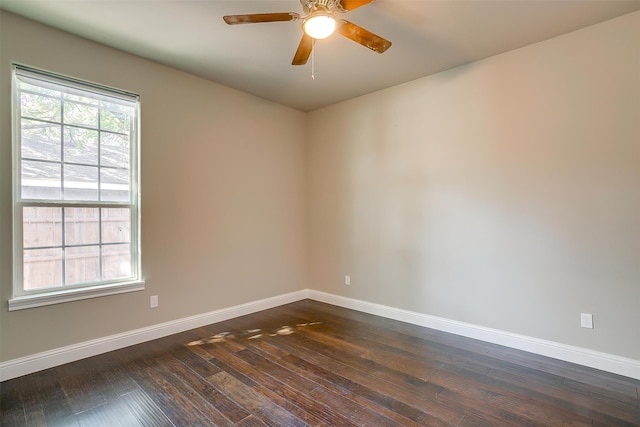 spare room featuring dark hardwood / wood-style floors and ceiling fan