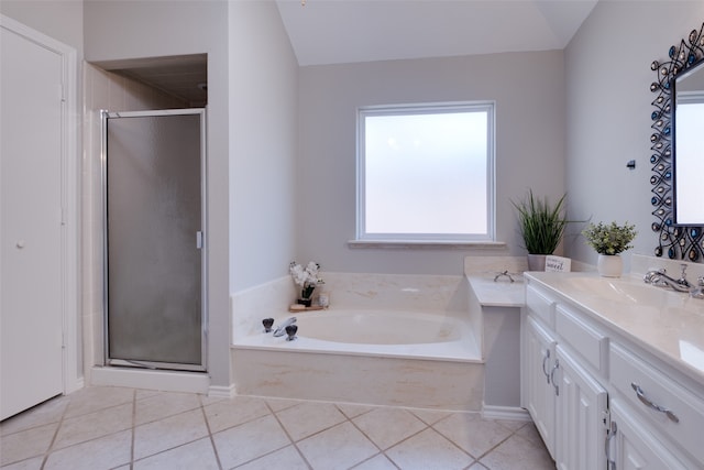 bathroom with tile patterned flooring, separate shower and tub, and vanity