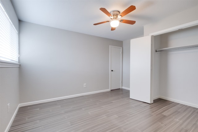 unfurnished bedroom featuring a closet, ceiling fan, and light hardwood / wood-style flooring