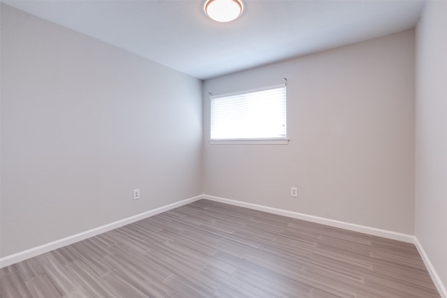 unfurnished room featuring light hardwood / wood-style flooring