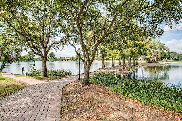 surrounding community featuring a water view