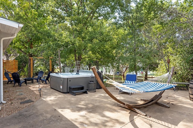 view of patio / terrace with a hot tub