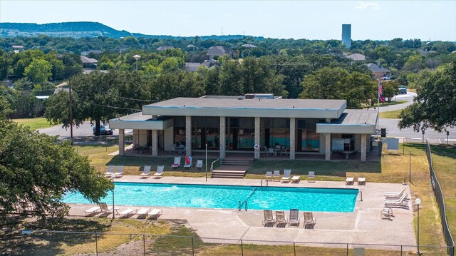 view of swimming pool with a lawn and a patio