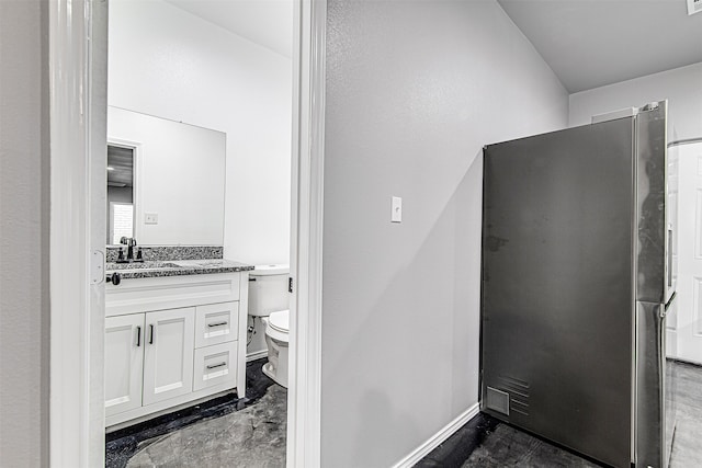 bathroom with vanity and toilet