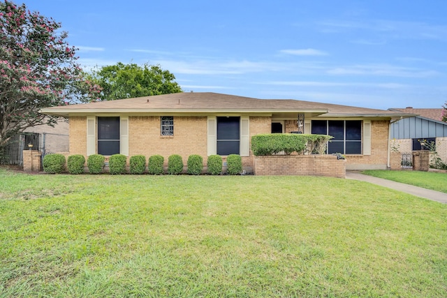 ranch-style house with a front lawn