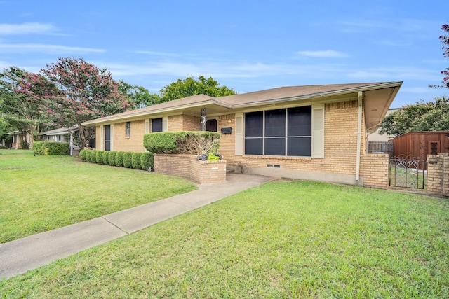 single story home featuring a front lawn