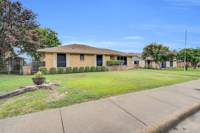 ranch-style house with a front yard