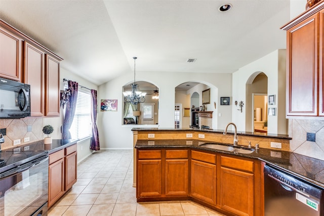 kitchen featuring backsplash, sink, black appliances, light tile patterned floors, and a notable chandelier