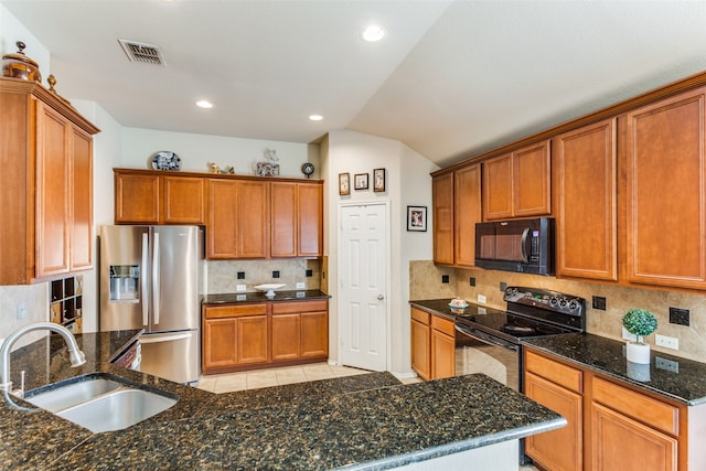 kitchen featuring sink, decorative backsplash, black appliances, and light tile patterned flooring