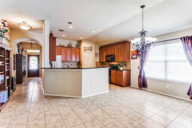 kitchen featuring tasteful backsplash, black appliances, an inviting chandelier, and light tile patterned floors