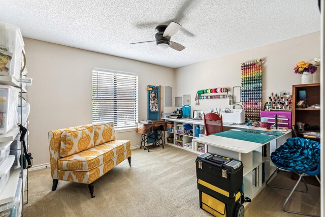 office with light carpet, a textured ceiling, and ceiling fan