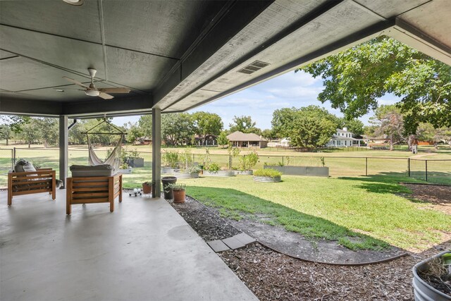 exterior space featuring ceiling fan and a patio