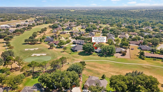 birds eye view of property featuring view of golf course and a residential view