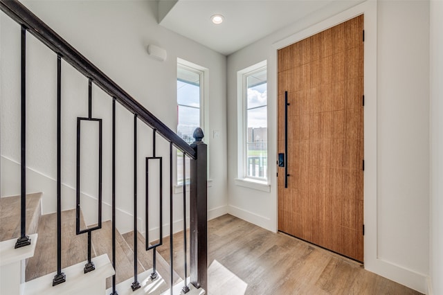 entryway with light hardwood / wood-style flooring