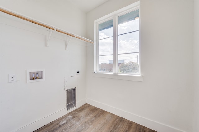 laundry area featuring hookup for an electric dryer, plenty of natural light, hookup for a washing machine, and hardwood / wood-style floors