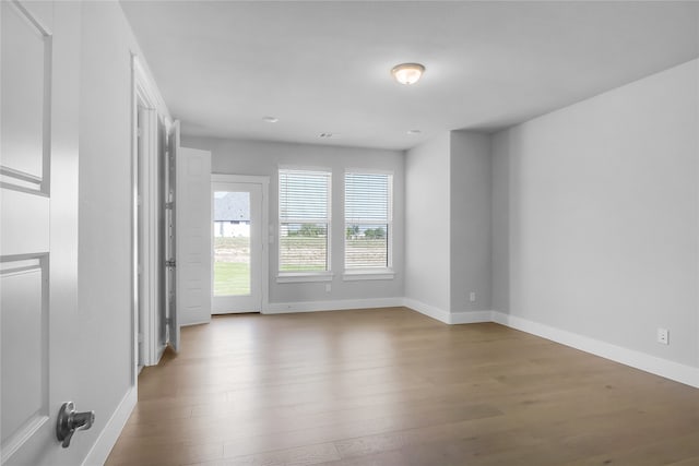 empty room with wood-type flooring