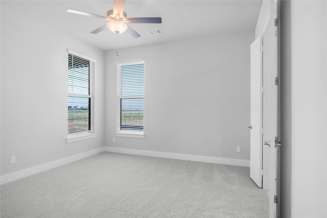 empty room with light carpet and ceiling fan