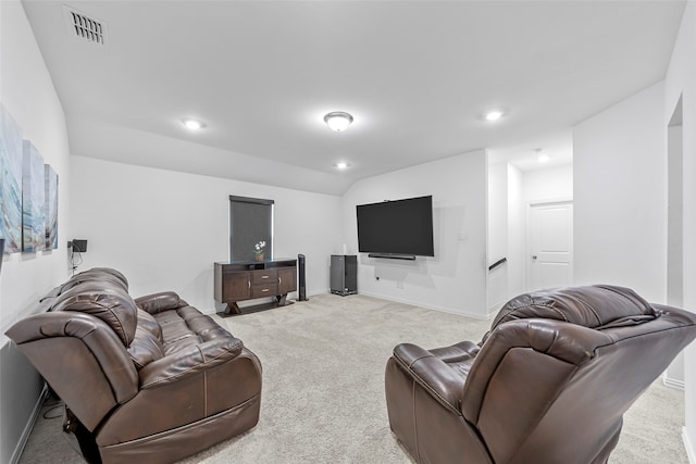 carpeted living room featuring lofted ceiling