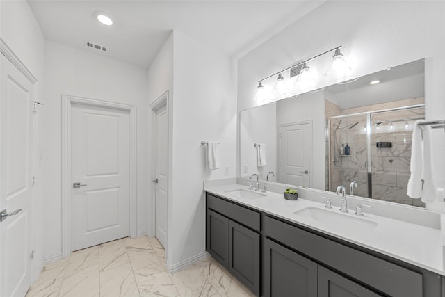 bathroom with a shower with door and vanity