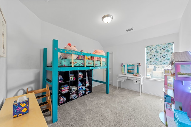 bedroom featuring carpet flooring and vaulted ceiling