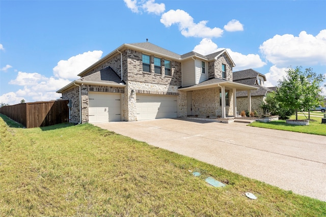 view of front of home featuring a garage and a front lawn