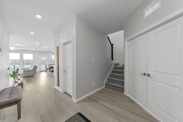 corridor featuring light hardwood / wood-style flooring