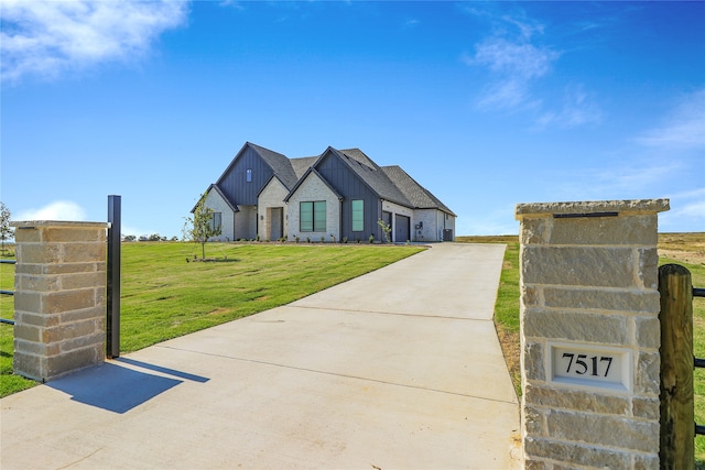 modern farmhouse featuring a front yard