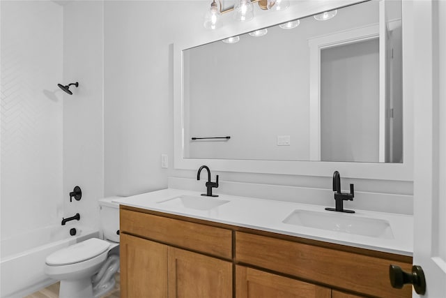 full bathroom featuring vanity, shower / washtub combination, and toilet