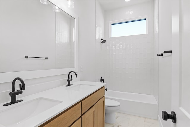 full bathroom featuring toilet, tiled shower / bath, and vanity