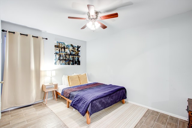 bedroom featuring ceiling fan and light hardwood / wood-style flooring