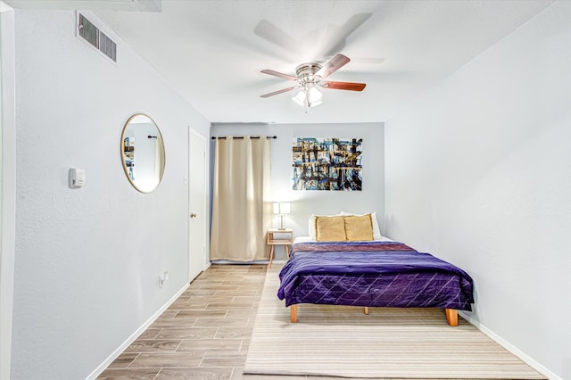 bedroom featuring ceiling fan and light wood-type flooring