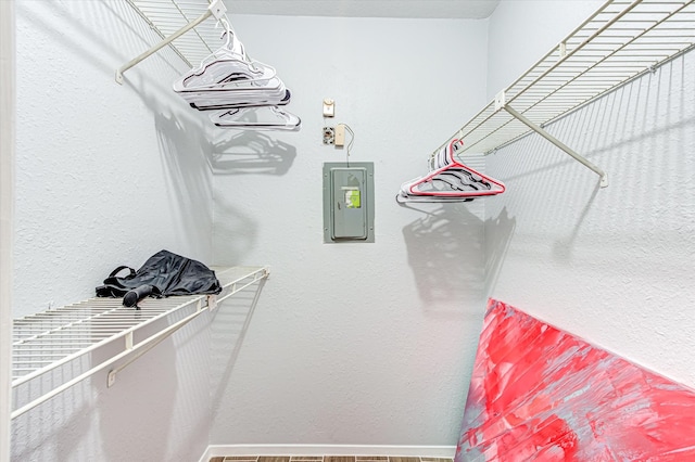 spacious closet featuring electric panel