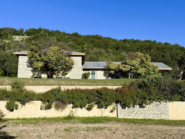 view of front of property with solar panels