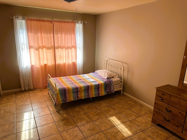 bedroom featuring tile patterned floors