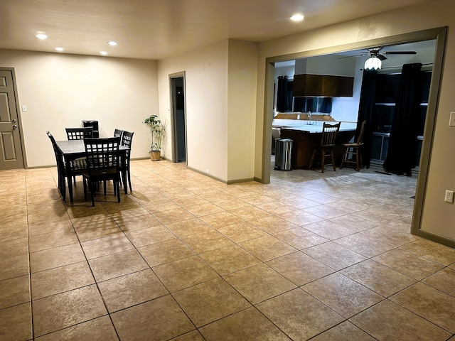 dining area featuring ceiling fan and light tile patterned floors