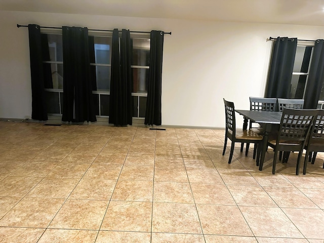 dining space with tile patterned floors