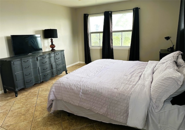 bedroom with light tile patterned floors